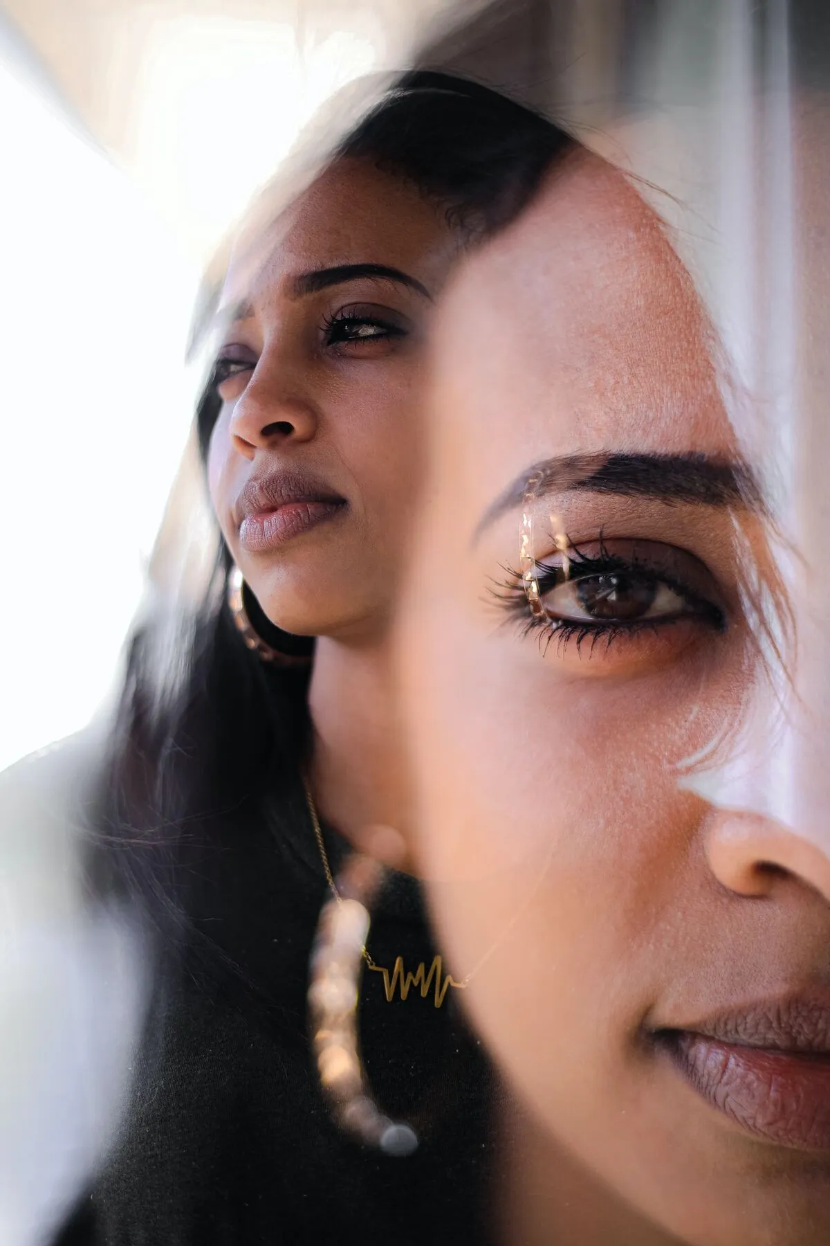 woman-in-white-shirt-with-gold-necklace